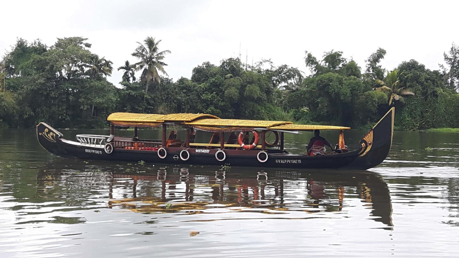 A traditional country boat moored on the still backwater